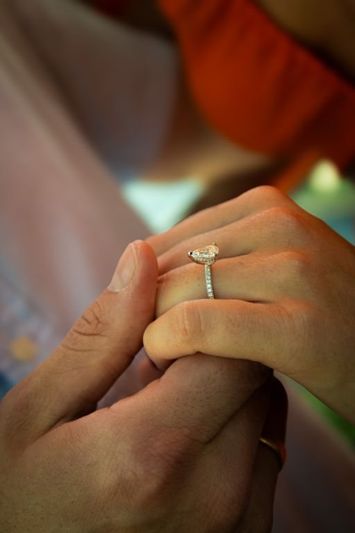 Holding hands, the ring in focus